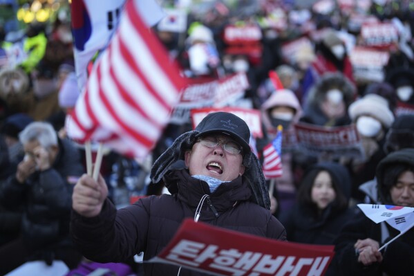 South Korea’s impeached president defies warrant after hourslong standoff